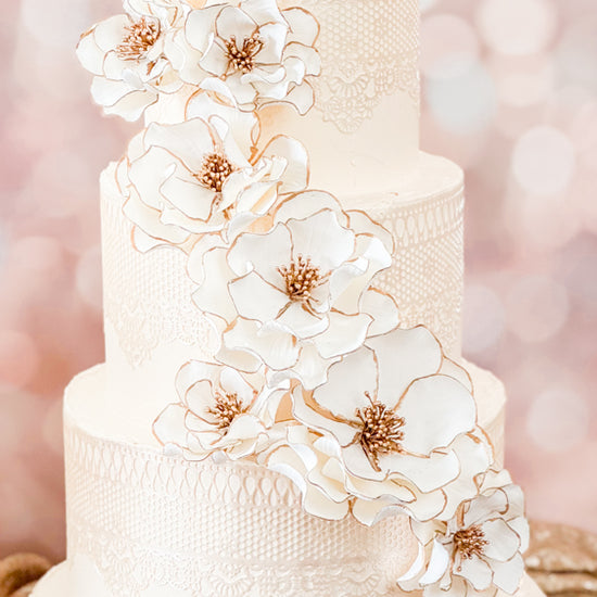 gold trim classic cascade video of how to place flowers on the cake